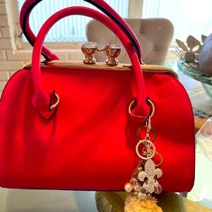 $35 Beautiful round pink purse with a Swirsky stones clasp show stopper.